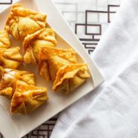 Fried Crab Rangoon · Fried wonton wrapper filled with crab and cream cheese.