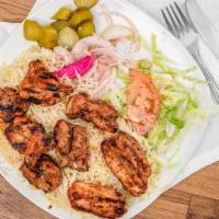 *Chicken Kebab · Traditionally marinated chicken thighs with garlic, lemon, and black pepper.