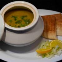 *Lentil Soup · A hearty soup made with lentils and onions. Served with pita bread.