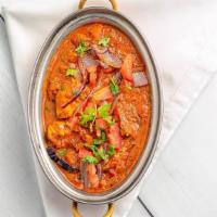 Karaikudi Curry (Cs) · Choice of meat sautéed and cooked in mild sauce and spices in Chettinad style.
