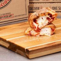 Pepperoni Maniac Calzone · Extra pepperoni & wisconsin cheese.  Finished with garlic butter and a Parmesan Romano seaso...