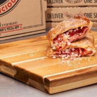 Original Meat Calzone · Ham, salami & pepperoni with cheese. Finished with garlic butter and a Parmesan Romano seaso...