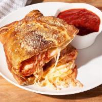 Cheese Maniac Calzone · Loaded with fresh mozzarella, Wisconsin cheese blend & Cheddar. Finished with garlic butter ...