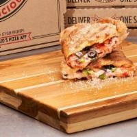 Veggie Calzone · Mushrooms, red onions, green peppers, black olives & tomatoes with cheese. Finished with gar...