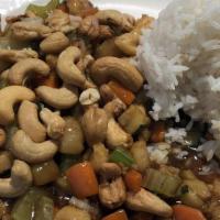 Cashew Chicken · Stir-fried with bell peppers, celery, and water chestnuts in a brown sauce, topped with cash...