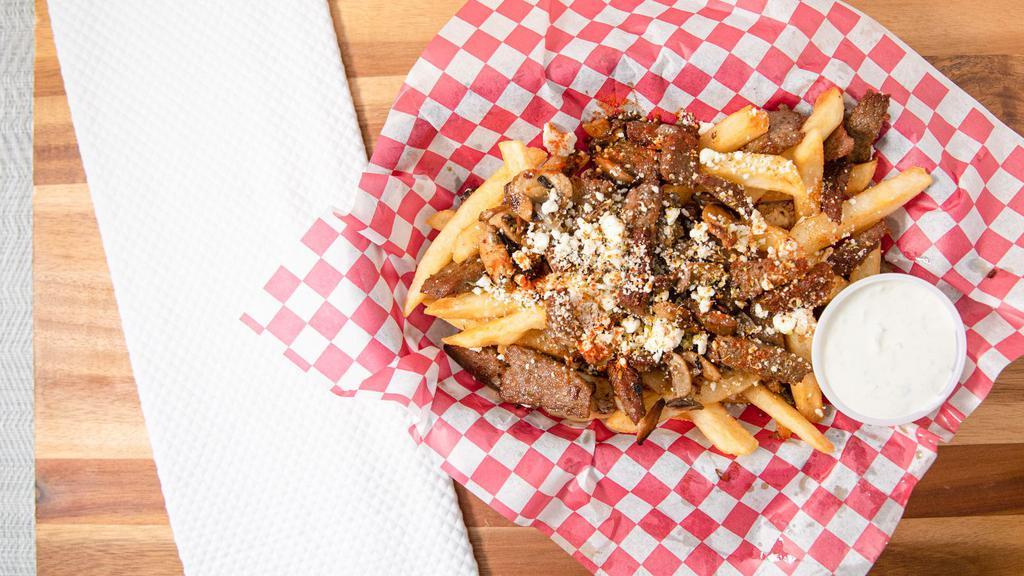 Greek Fry Platter · Fries topped with gyro meat, grilled onions, and mushrooms, Feta cheese, and oregano.