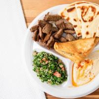 House Platter · Gyro meat, hummus tabouli, and spinach pie.