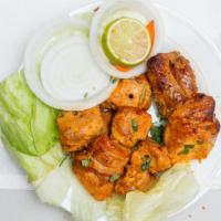 Boti Chicken · Tender chunks of boneless chicken combined with fresh peppers & onions, cooked on a hot plat...
