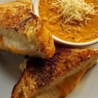 De-Luxe Grilled Cheese · Mother of all grilled cheeses. Cheddar, pepper jack, and provolone on parmesan-crusted bread...