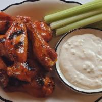 Wings · Tossed with your choice of cajun dry rub, buffalo sauce, or sweet & spicy bbq sauce, then ki...