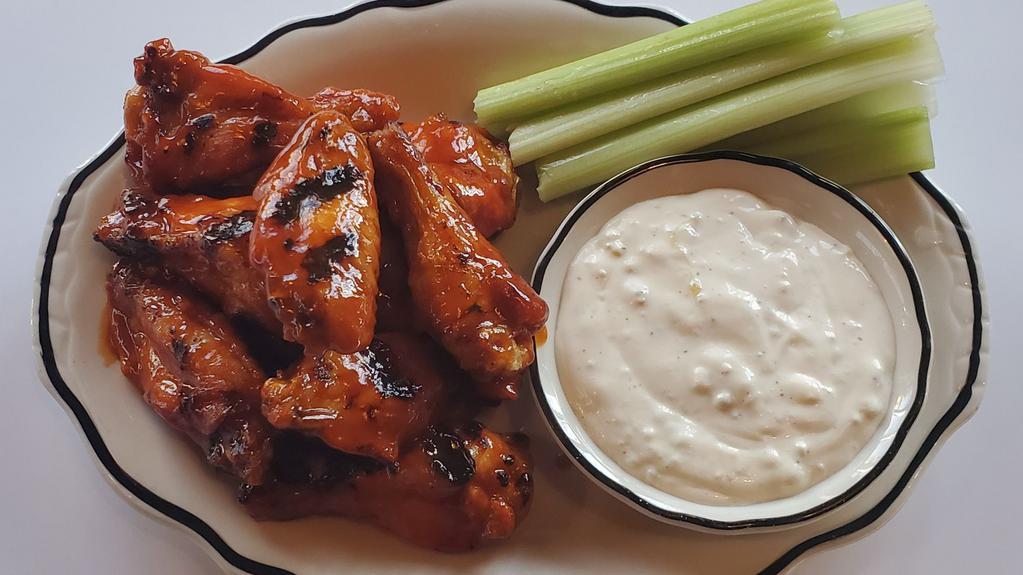 Wings · Tossed with your choice of cajun dry rub, buffalo sauce, or sweet & spicy bbq sauce, then kissed by the grill. Served with our bleu cheese sauce. Muah!