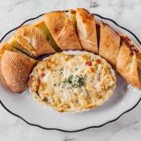 Artichoke Dip · Vegetarian. Our signature dish! Baked casserole of artichoke hearts and spices, garlic toast