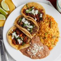 Taco Dinner · Includes choice of 3 tacos, and choice of side: Rice & Beans, Chips & Salsa, or French Fries