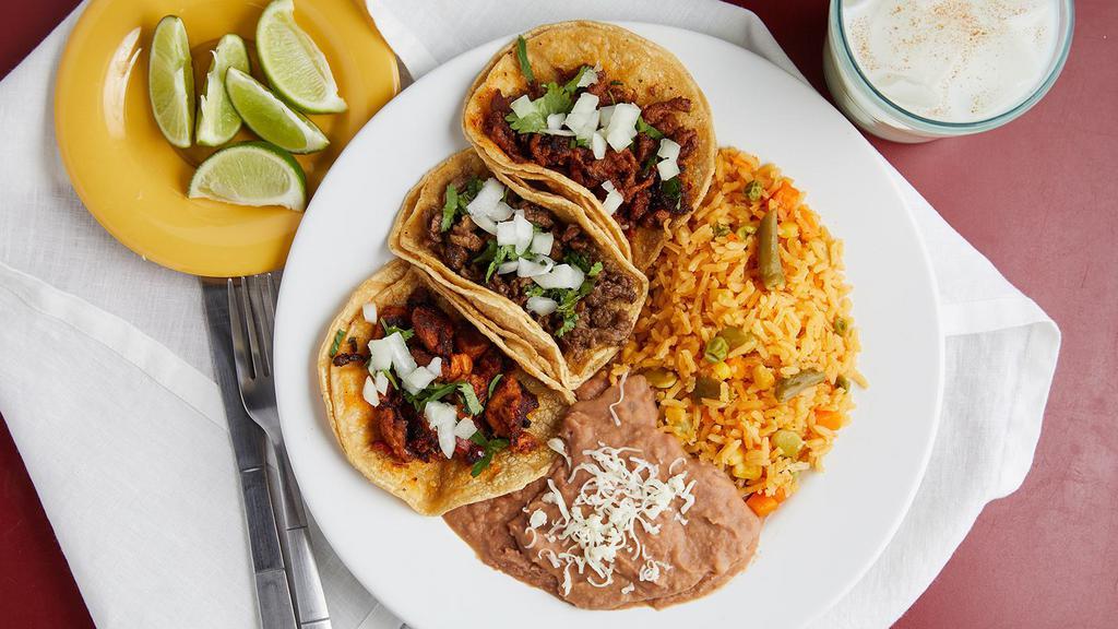 Taco Dinner · Includes three tacos, rice & beans.