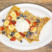 Fresh Fruit Creppe · Filled with seasonal fresh fruit and topped with low fat greek yogurt and granola.