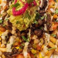 Carne Asada Fries · French fries topped with carne asada, melted cheddar cheese, guacamole, pico de gallo and ro...
