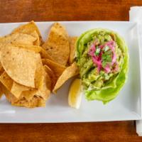 Guacamole & Chips · Vegan. Made fresh with chopped cilantro and onions, diced tomatoes, fresh lime juice and tor...