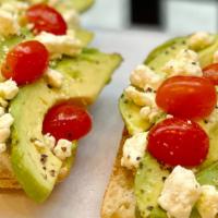 Tartine Méditerranéenne · Toasted french baguette, avocado, tomato, feta cheese, chia seeds, olive oil. Serve with sid...