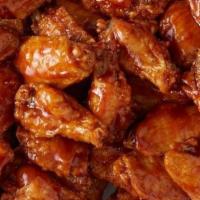 Chicken Wings 25 Pieces (Medium Size) · 25 Medium Size wings fried and smothered in choice of Buffalo, BBQ or Honey BBQ Sauce