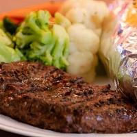 Steak · Ribeye steak with loaded Potato and steamed vegetables.