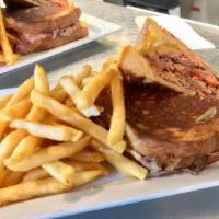 Prime Rib Sandwich · Served with french fries and a 20 oz soft drink.