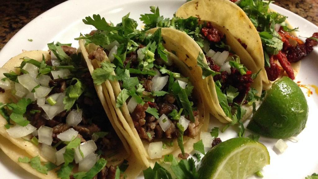 Taco Plate · Three tacos with choice of protein. Served with rice and beans.