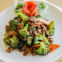 Beef With Broccoli · Sliced beef sautéed with broccoli, carrots in brown sauce.