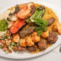 Pita Palace Mix Grill · Three skewers of grilled kabob (shish kabob, katta kabob, chicken shish tawook) and rice, co...