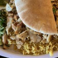 Chicken Shawarma Plate · Chicken shawarma (succulent layers of chicken) comes with onion sliced, garlic sauce.