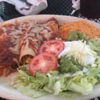 Enchiladas Mexicana · Three corn tortillas filled with savory spicy chicken, covered with poblano sauce, served wi...
