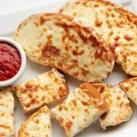 Cheese Bread · A Carbone's favorite- four slices of garlic bread smothered with Mozzarella cheese. Served w...