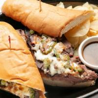 Philly Beef · Sliced roast beef on a toasted hoagie bun with sautéed mushroom, onion, and green pepper. Me...