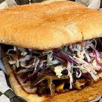 Smoked Maitake Sandwich · Smoked maitake mushroom, also known as Hen of the Woods, is served with creamy slaw and barb...