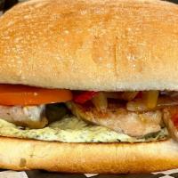 Roast Chicken Sandwich · Juicy, roast chicken thigh served with sautéed peppers and onions and chermoula aioli on a t...