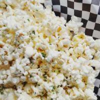 Truffle Popcorn · Popcorn tossed in truffle oil and parmesan, with chives sprinkled on top. Warning! This will...