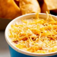 White Queso With Chorizo & Chips · Creamy white queso with mild chorizo, served with crispy fresh fried corn tortilla chips.