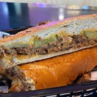 Cuban Sandwich · Marinated, shredded pork and honey ham, with melty Swiss cheese, stone ground mustard and sw...