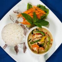 Green Curry · Green curry paste with coconut milk, bamboo shoots, meat, tofu, basil leaves, kaffir and bel...