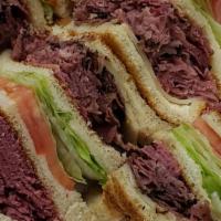 Jason'S Jammer · Corned Beef, Naval Pastrami, Swiss cheese, lettuce, tomato, dressing served on 4 slices of w...