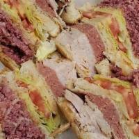 George'S Delicacy · Corned beef, salami, turkey, Swiss cheese, lettuce, tomato and Russian dressing.