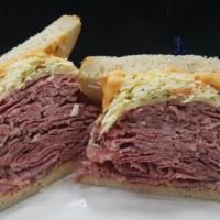Corned Beef (1/2) · Melted swiss cheese and Russian dressing and cole slaw.