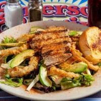 Cajun Chicken Salad · Cajun marinated chicken breast on mixed greens, pepper jack cheese, tomatoes, and wispy frie...