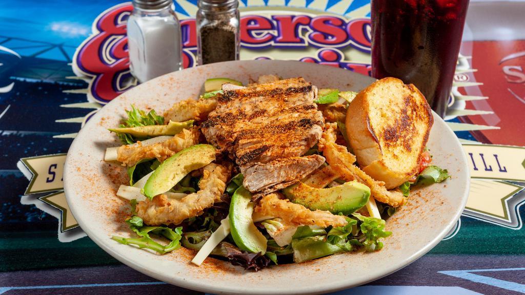 Cajun Chicken Salad · Cajun marinated chicken breast on mixed greens, pepper jack cheese, tomatoes, and wispy fried red onion strings.