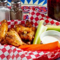 Bone-In Wings · Baked and fried crispy to finish.  Tossed in Buffalo, BBQ, Sweet Teriyaki.  Served with carr...