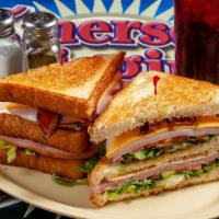 Traditional Club · Thick sliced white bread piled high with pit ham. Smoked turkey, American, and swiss cheese,...