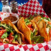 Big Lou'Sfamous Fried Tacos · Fried flour tacos stuffed with beef or chicken, cheese, lettuce, and tomatoes.