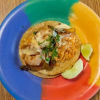 Shrimp Taco · Salted shrimp, rice, grilled green pepper and onion, topped with queso.