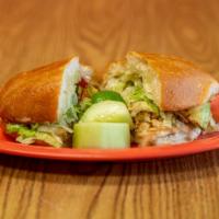 Torta · A Mexican style sandwich filled with your choice of meat, lettuce, tomatoes, onions, mayo, a...