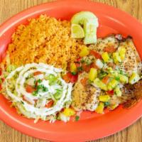 Pescado Frito · Salted tilapia, topped with oily pineapple pico served with rice.