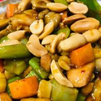 Kung Pao Chicken · Spicy. Diced chicken with carrot, bamboo, celery, green peppers, and onion in a spicy brown ...